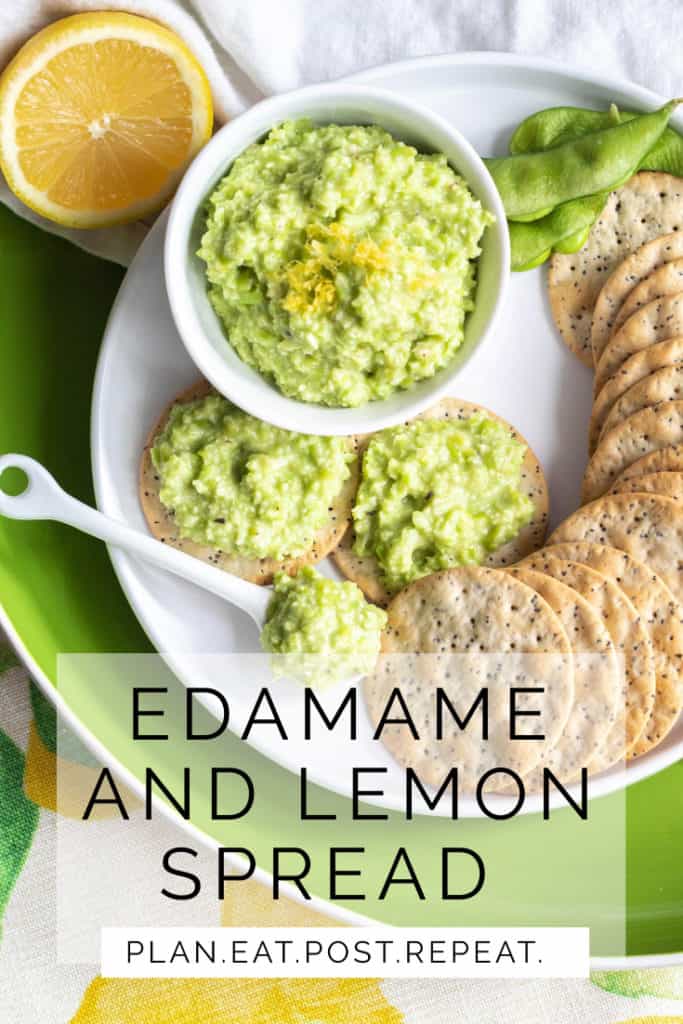 A platter of a green spread in a small bowl alongside crackers.  The words, "Edamame and Lemon Spread" are towards the bottom.