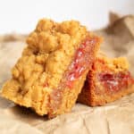 Peanut Butter and Jelly Bars on a crumpled paper bag surface.