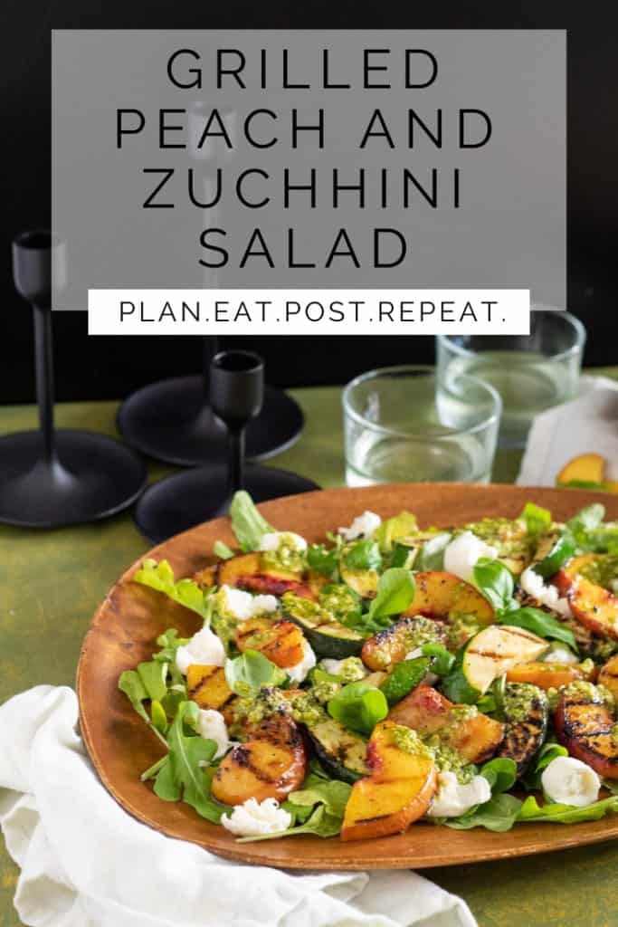 The words, "Grilled Peach and Zucchini Salad" at the top with a colorful composed salad on a wooden platter at the bottom. 