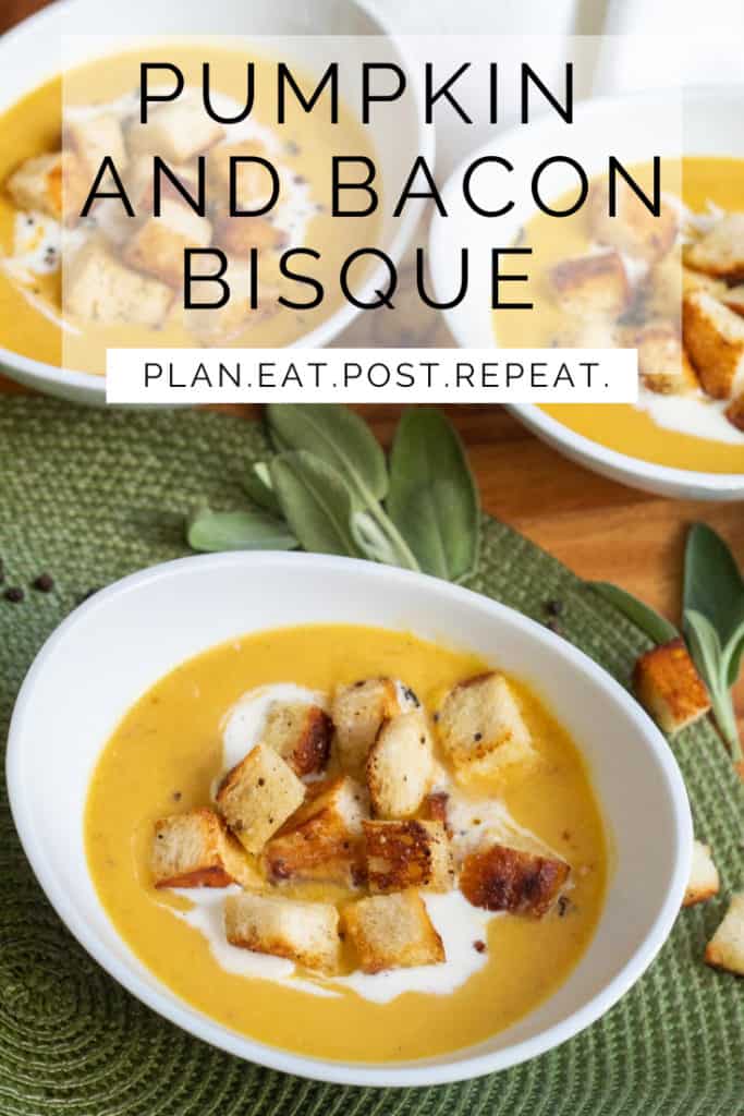 A white bowl of soup on a green placemat with the workd "pumpkin and bacon bisque" and "plan. eat. post. repeat." superimposed over the top of the image.
