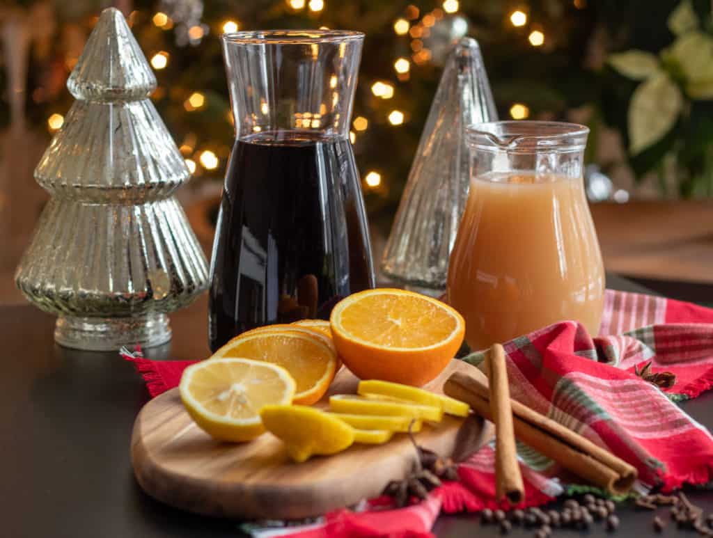 Ingredients for Mulled Wine are displayed on a black surface.