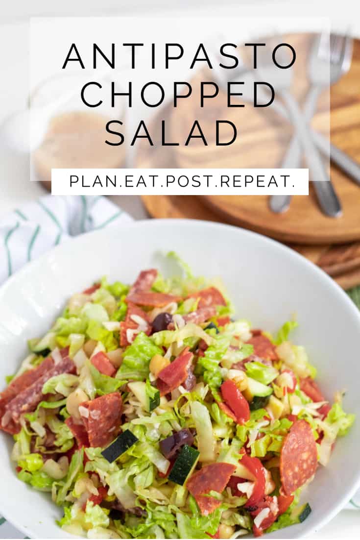 A bowl of a mixed chopped salad is in the lower part of the image. A white box with the words, " Antipasto Chopped Salad" are in a box above and "Plan. Eat. Post. Repeat." is in a white rectangle in the middle.