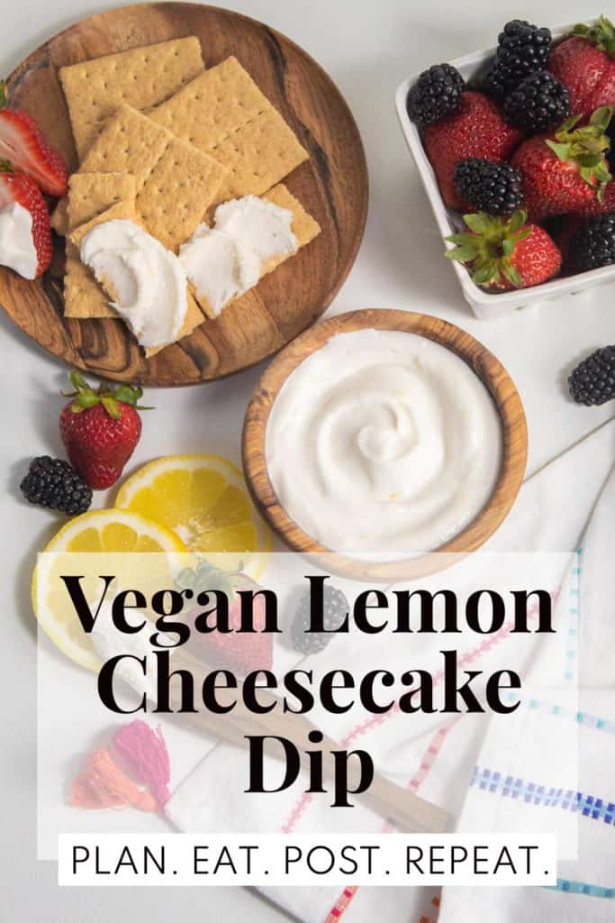 Graham crackers, lemons, and berries are arranged on a white background along with a bowl of white sauce. The words, "Vegan Lemon Cheesecake Dip" are overlaid in a shaded box towards the bottom. "Plan. Eat. Post. Repeat." is in a white rectangle at the very bottom.