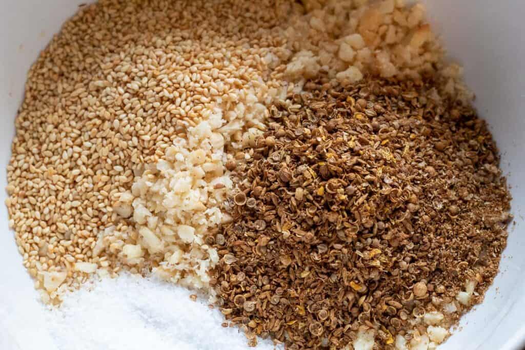 Macadamia dukkah ingredients roasted and processed into coarse texture.