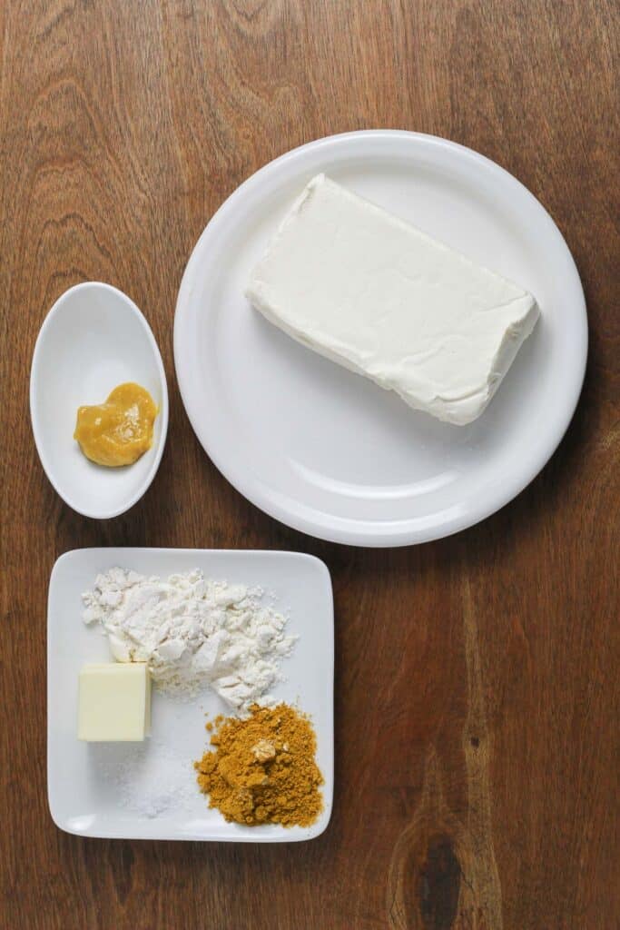 The ingredients for the curry sauce displayed on a wooden surface.