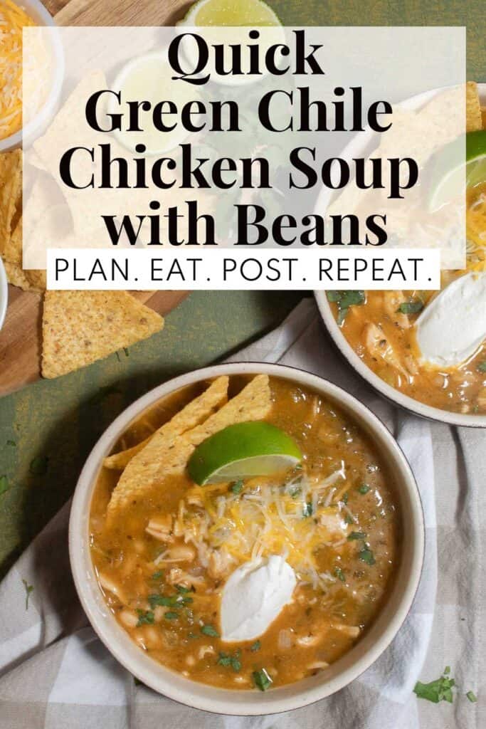 A white bowl with a reddish-brown soup sitting on a green surface. The soup has sour cream, cheese, lime, and chips as garnish. The words, "Quick Green Chile Chicken Soup with Beans" and "Plan. Eat. Post. Repeat." in a box at the top of the image.