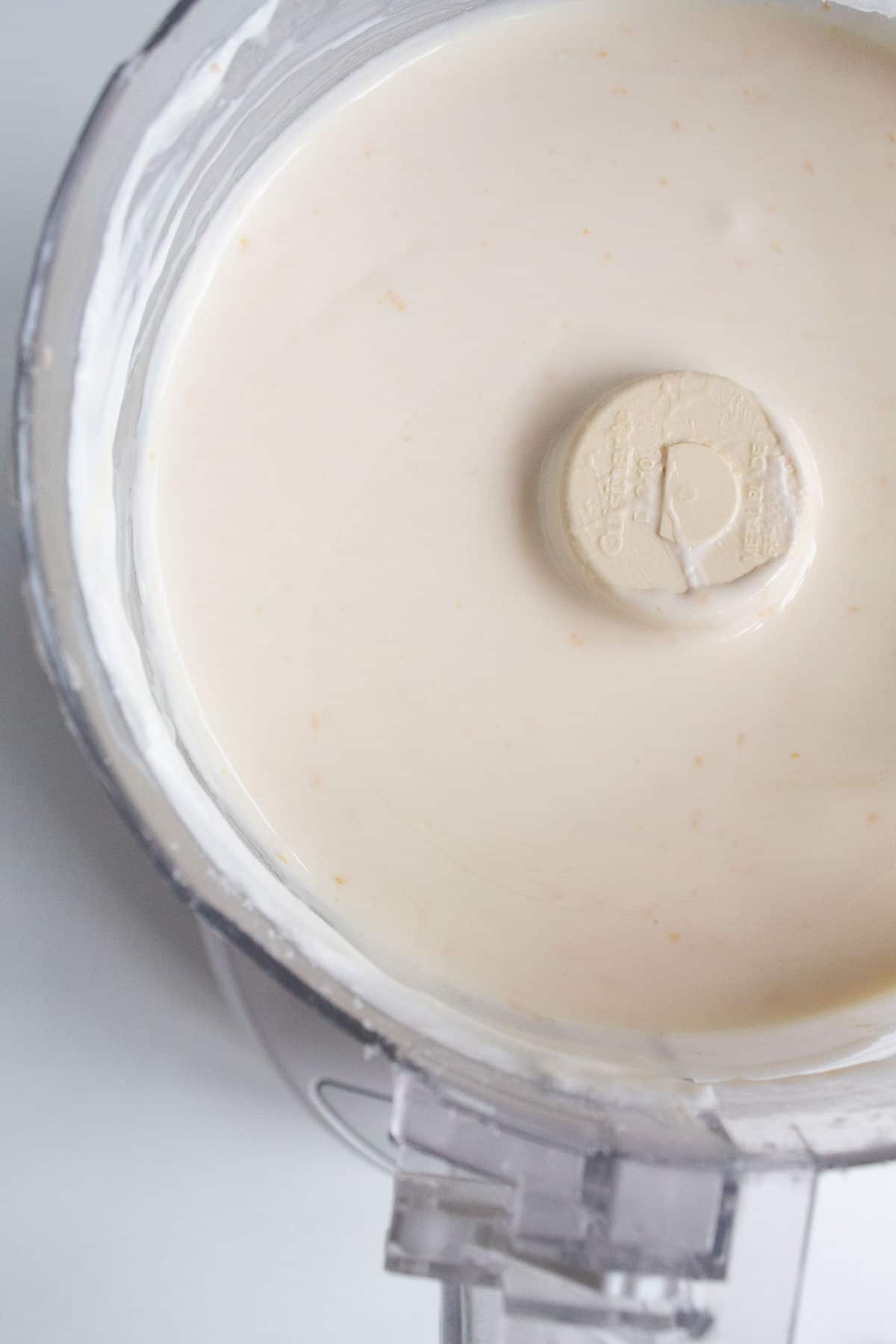 The cream cheese cheesecake filling mixed in a food processor.
