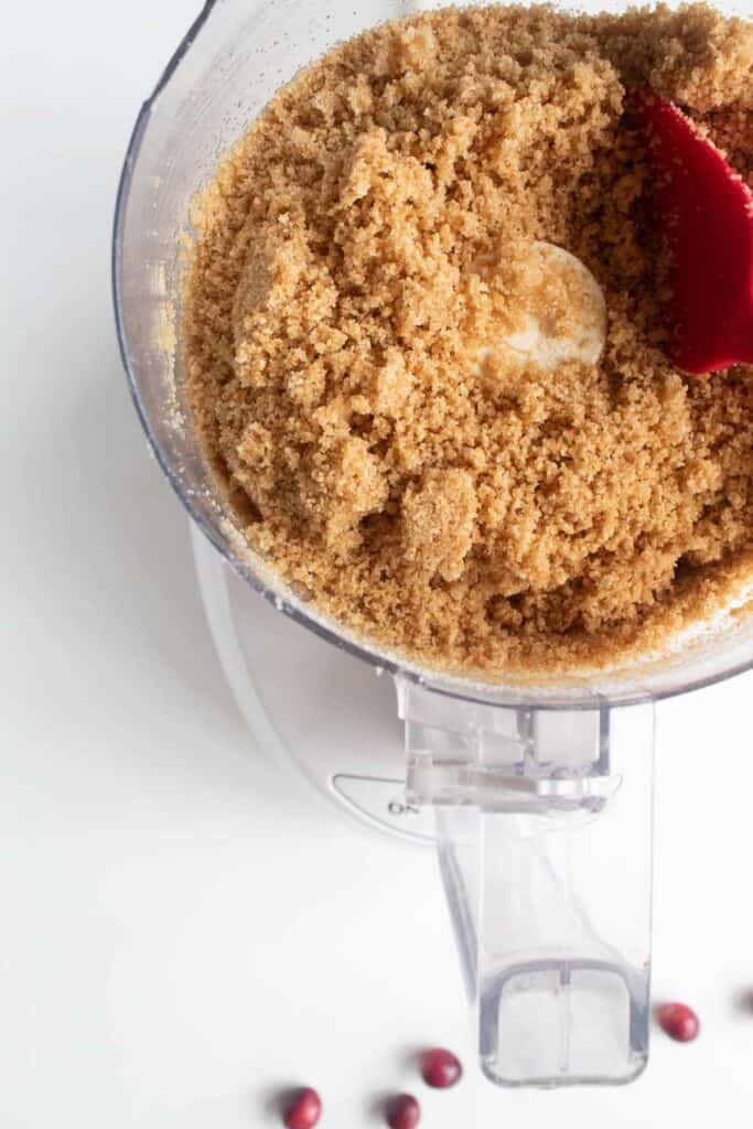 The graham cracker crust mixed in a food processor.