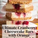 A stack of red and white dessert bars with brown graham cracker crust sitting on a wood plate. The words, "Ultimate Cranberry Cheesecake Bars with Orange Cranberry Swirl" and "Plan. Eat. Post. Repeat." are in a box at the bottom.
