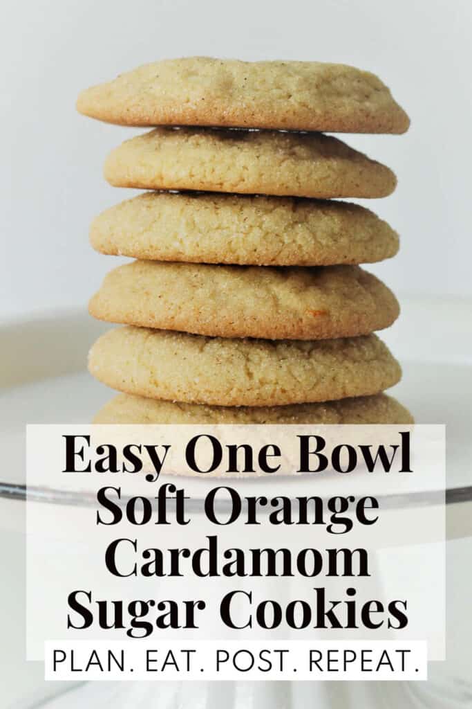 A tall stack of golden-edged cookies sitting on a white plate with a black rim. The words, "Easy One Bowl Soft Orange Cardamom Sugar Cookies" and "Plan. Eat. Post. Repeat." are in a box at the bottom.