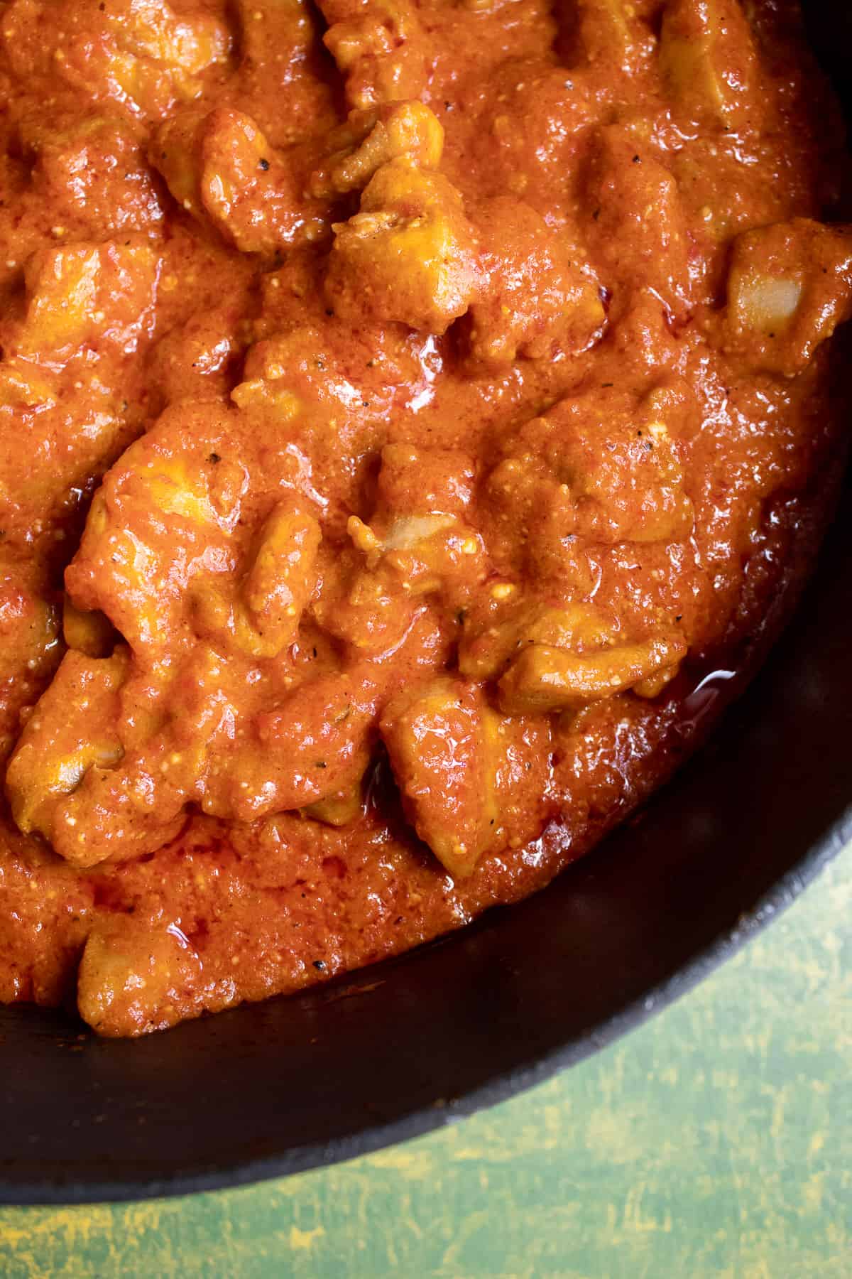 A detailed photo of the orange sauce and chicken in the skillet once fully cooked.