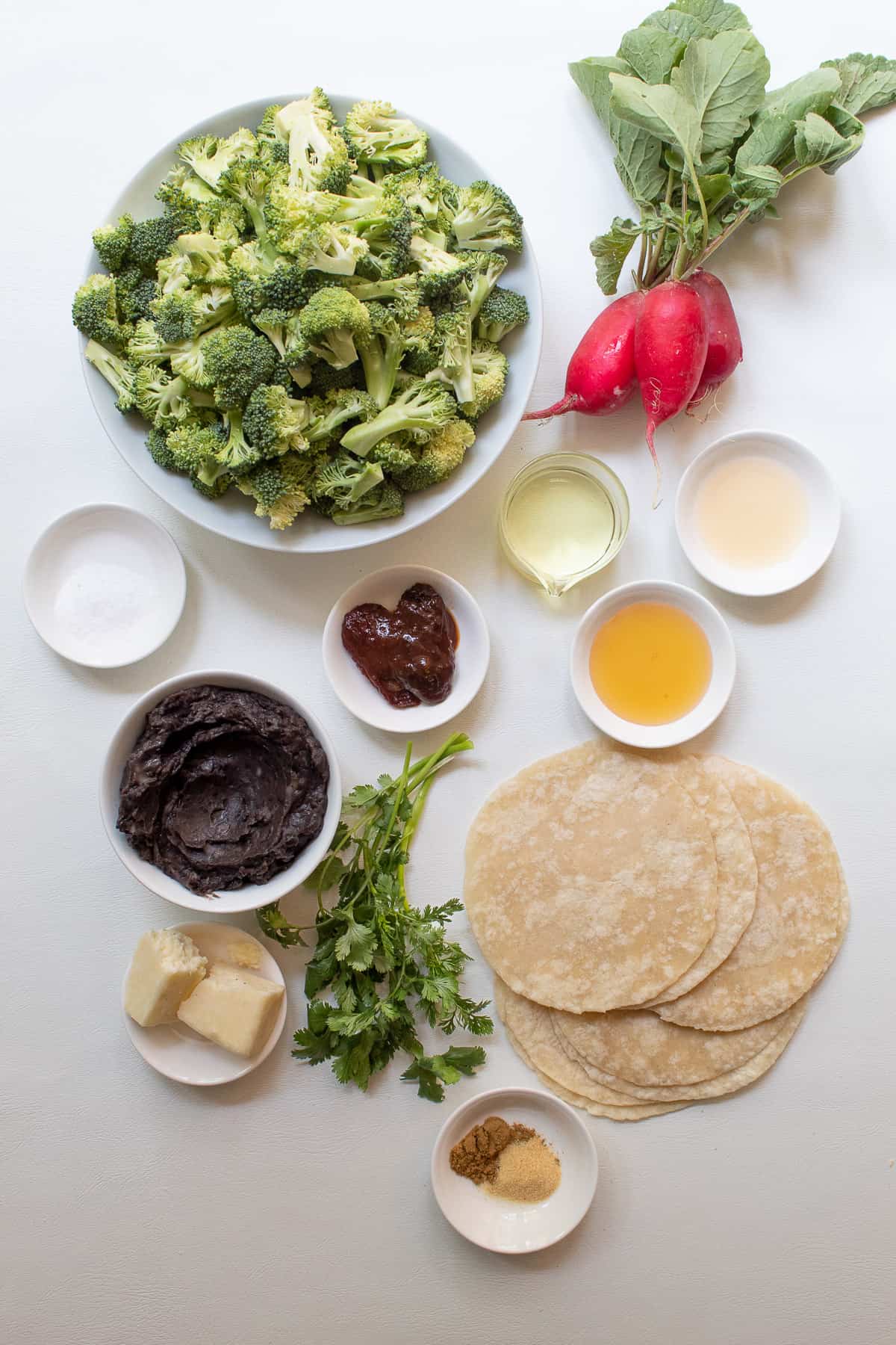 The ingredients for the recipe are arranged on a white surface.