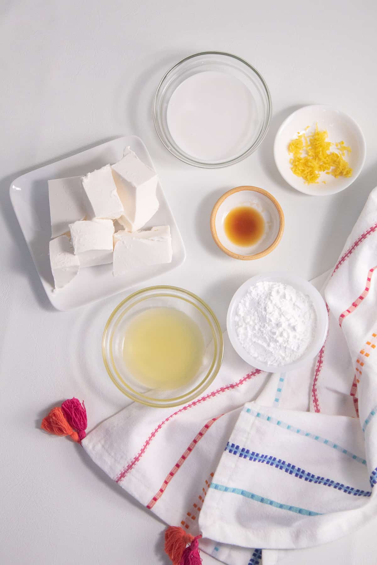 Ingredients for the fruit dip are arranged on a white surface.