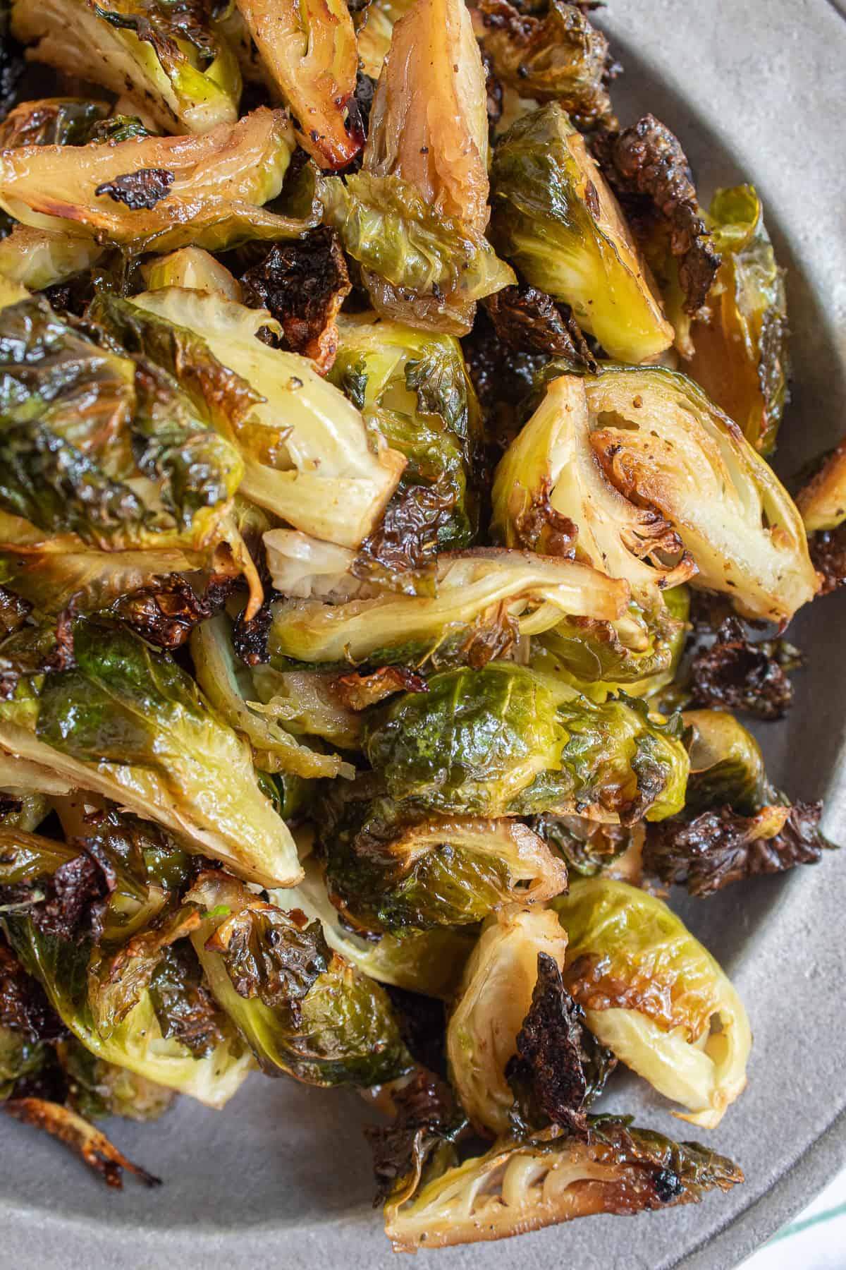 A detail image of the different degree of the caramelization on all of the brussel sprouts.