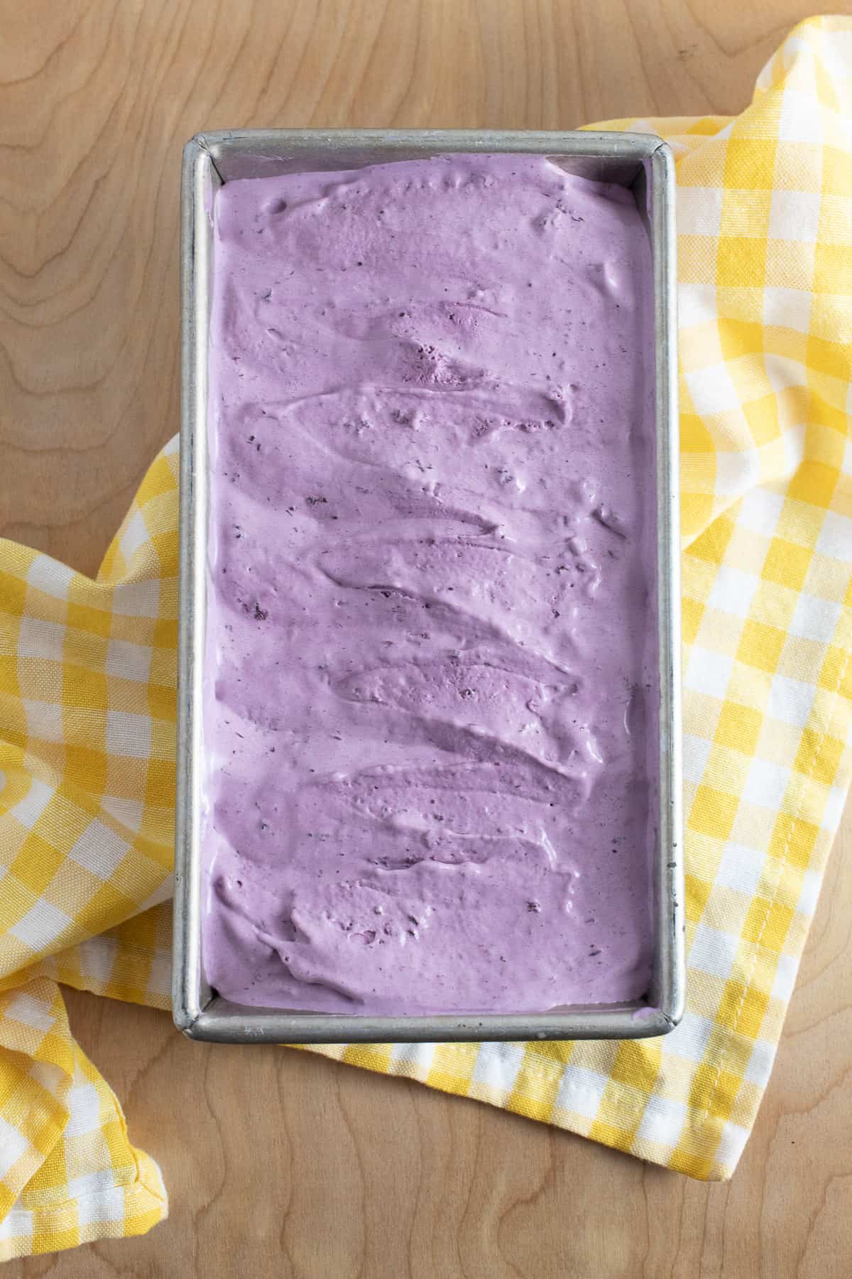 The churned ice cream after transferring into a loaf pan and smoothing the surface.