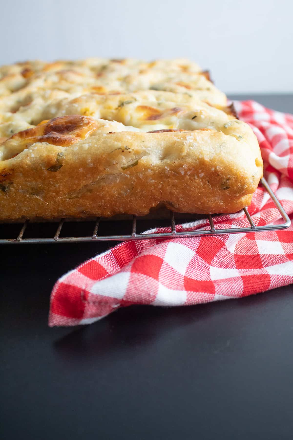 The crispy edges of the baked focaccia.
