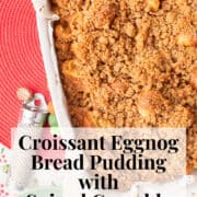 The baked bread pudding is golden brown with extra texture from the spiced crumble topping. A text box at the bottom of the image contains the words, "croissant eggnog bread pudding with spiced crumble" and "plan. eat. post. repeat."