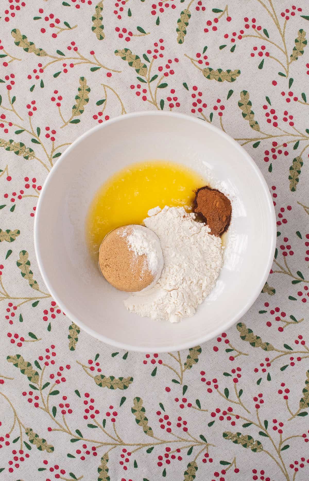 The spiced crumble ingredients are added to a medium bowl.