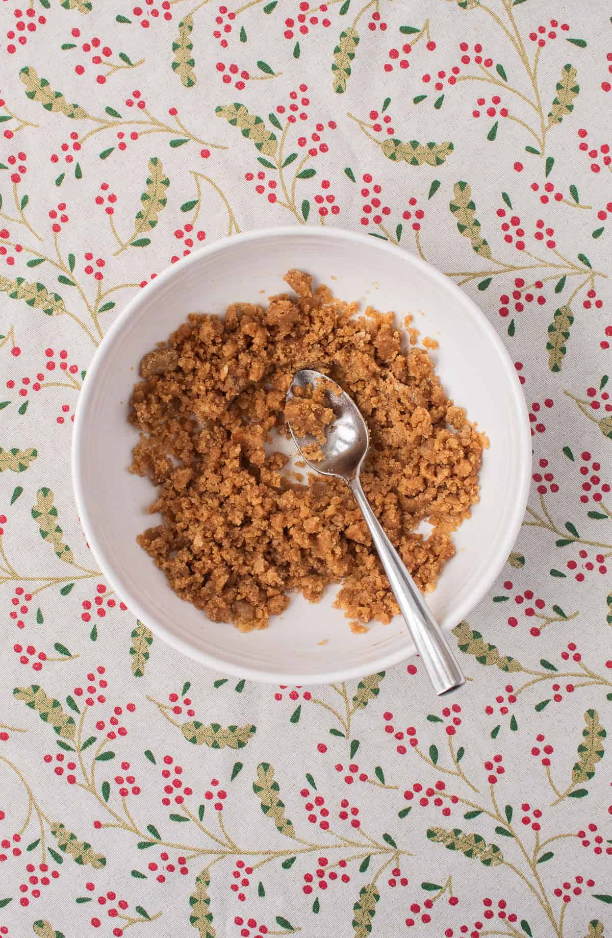 Once mixed together, the spiced crumble has a rough texture with pieces of crumble roughly the size of small pebbles.