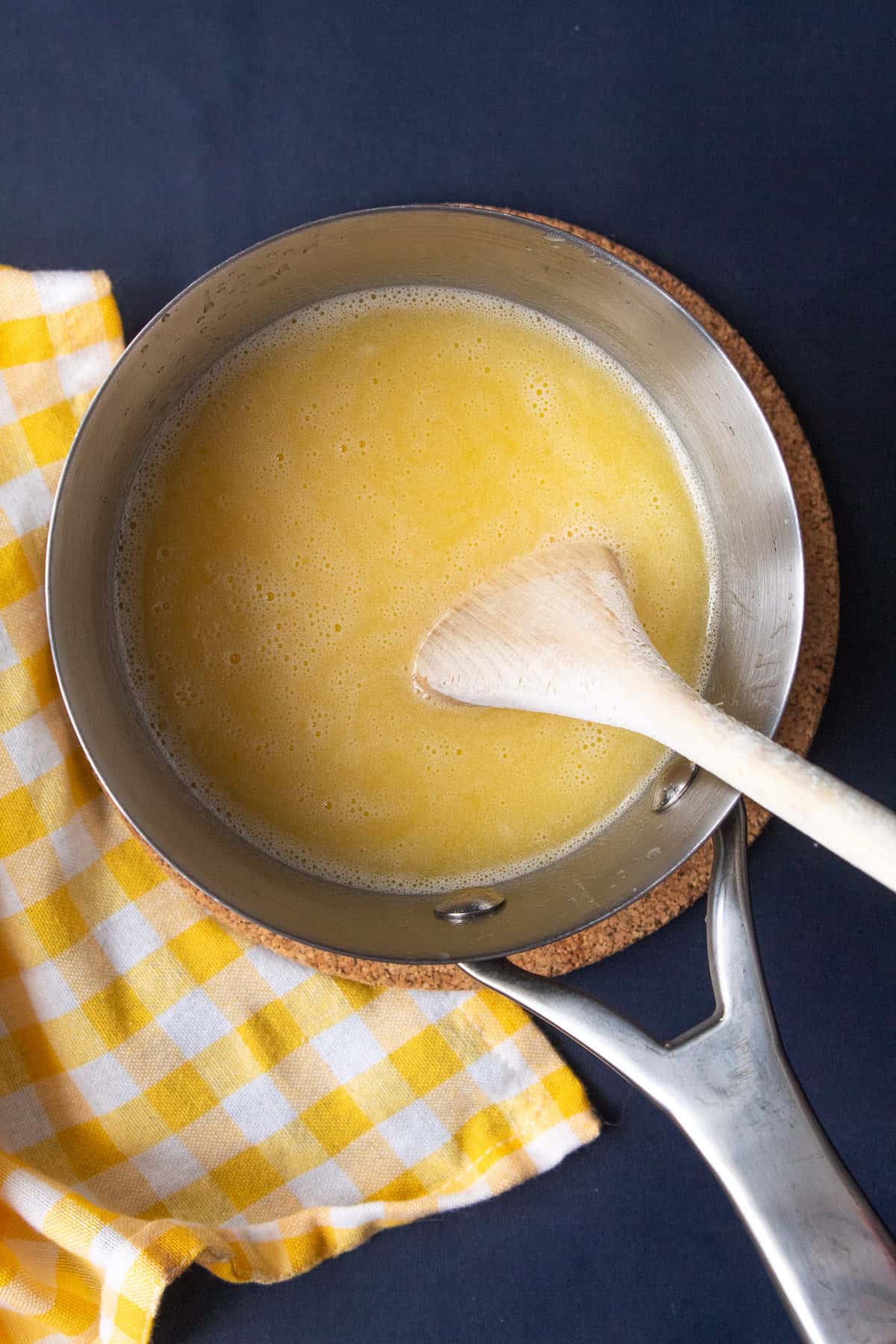 The mixture is heated in a small saucepan.