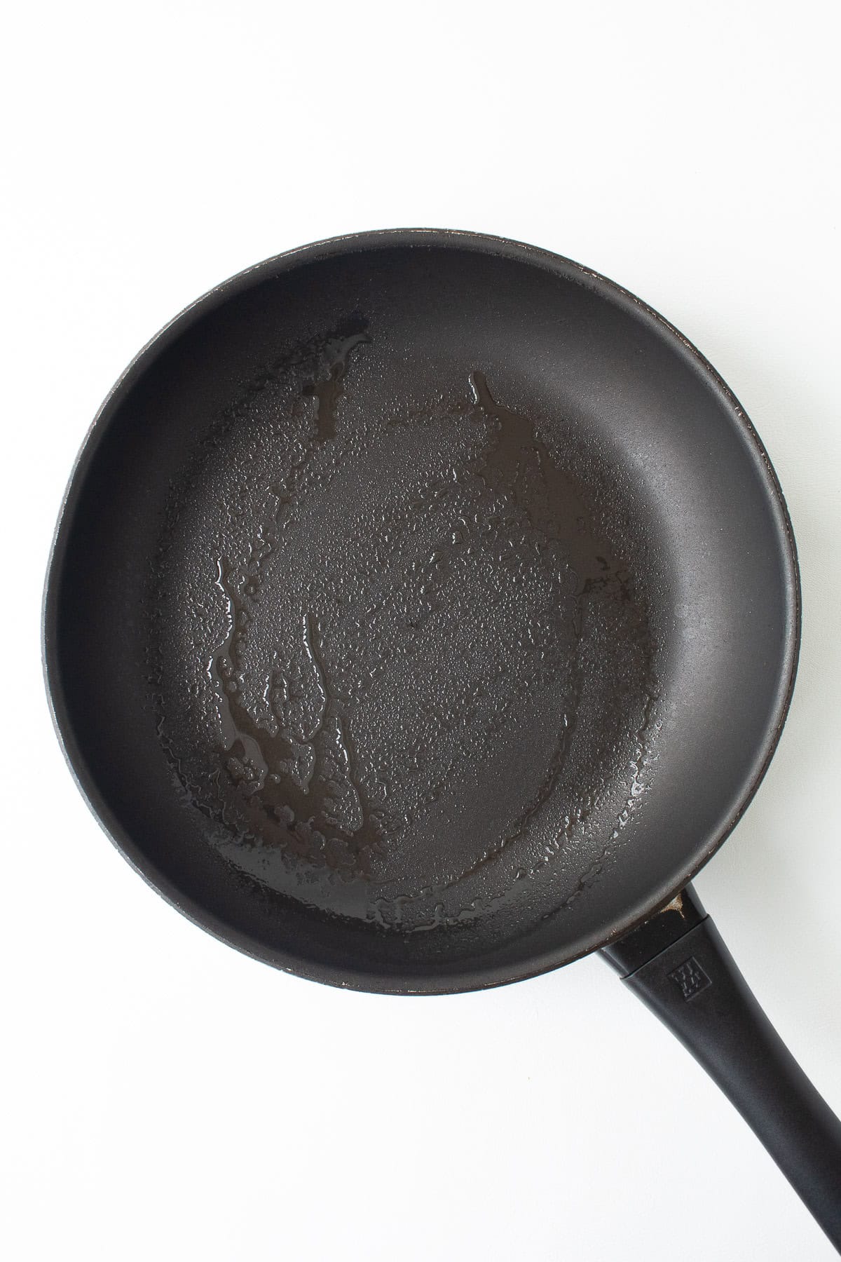 A nonstick skillet is sprayed with cooking spray.