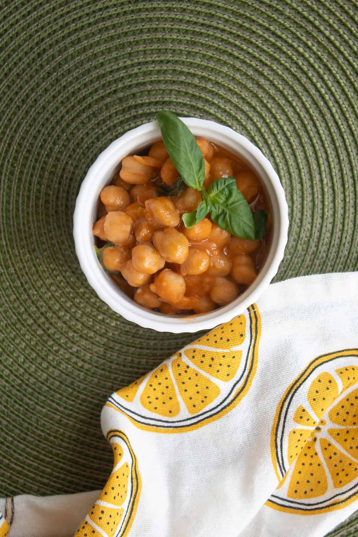 A small portion of the stew was reserved before adding the lemon juice and zest and placed in a small white bowl.