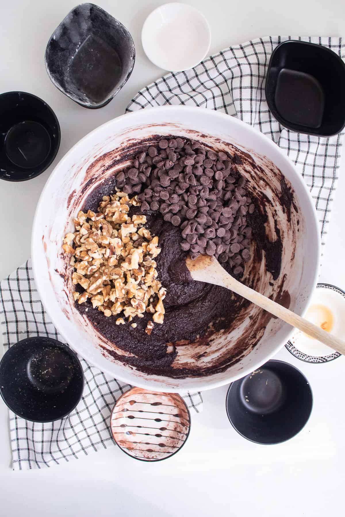 Chopped walnuts and chocolate chips are added to the cookie dough.
