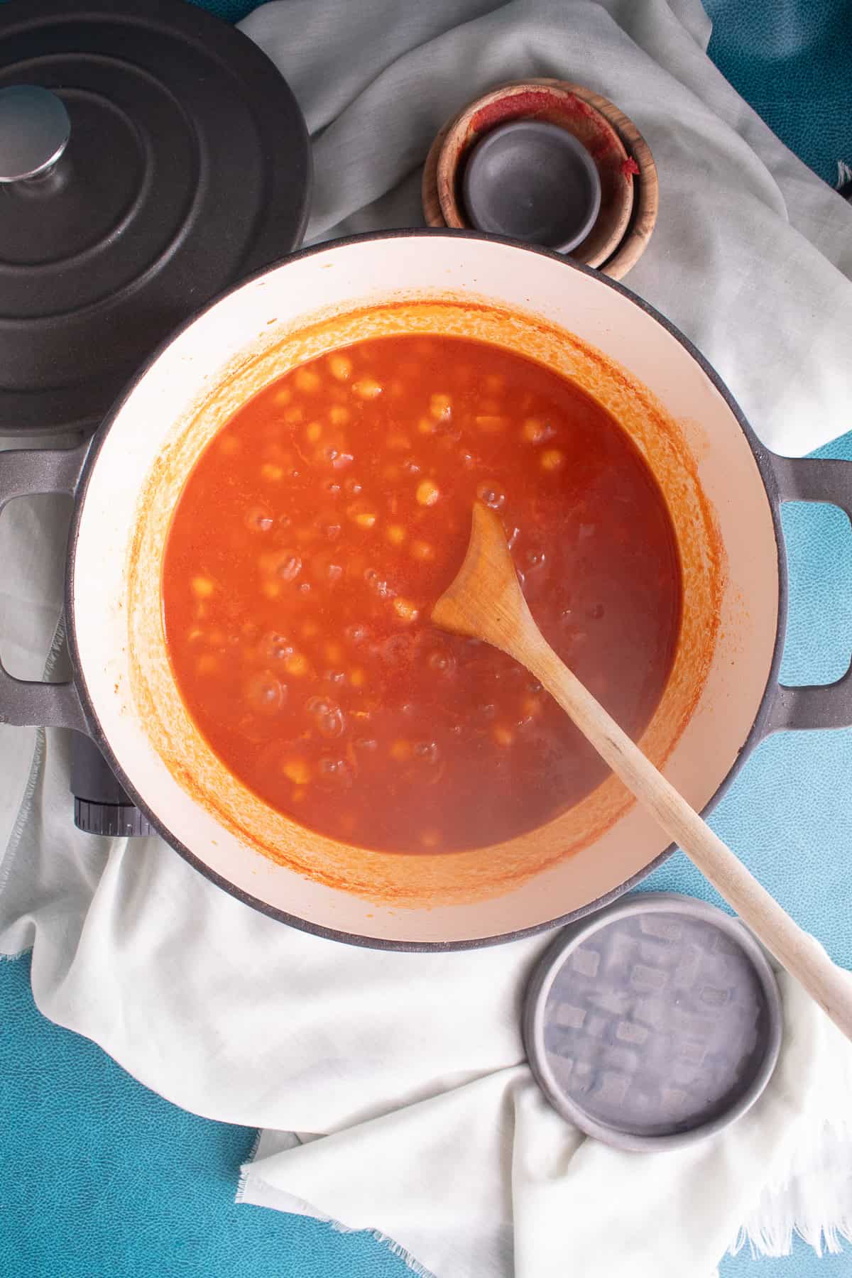 Once the pasta is cooked, the tomato sauce is a bright red-orange color.