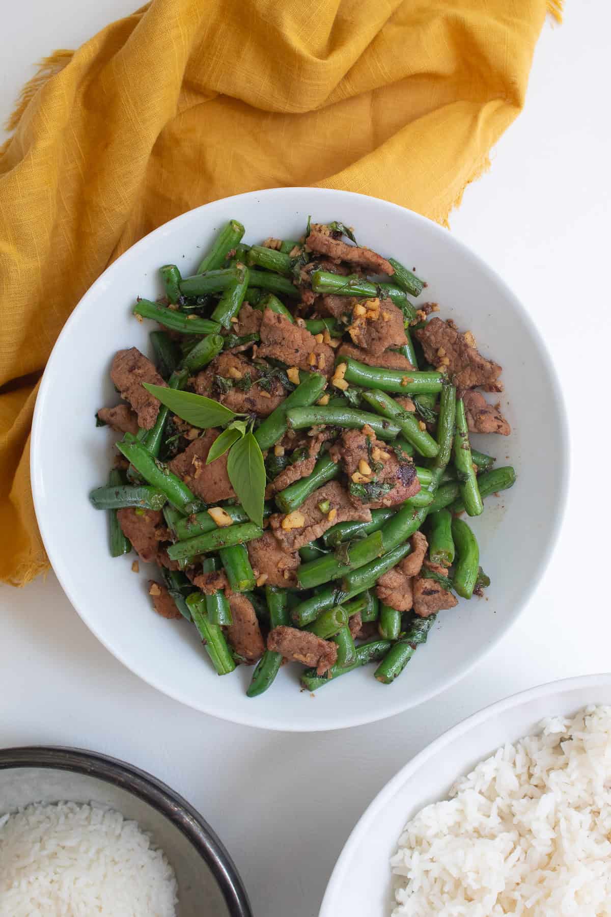 The stir fry transferred to a round white platter.