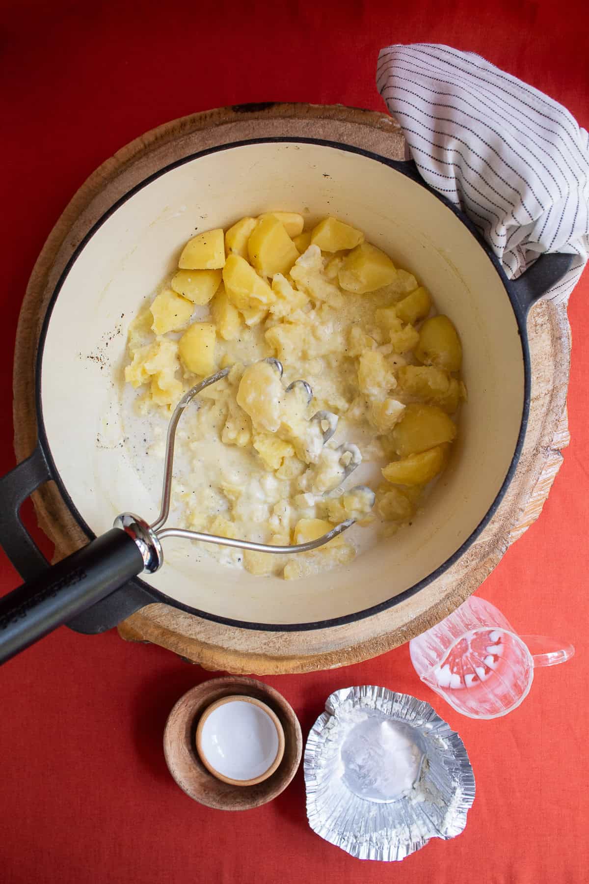 A potato mashed combines the potatoes with the boursin, milk, and butter.