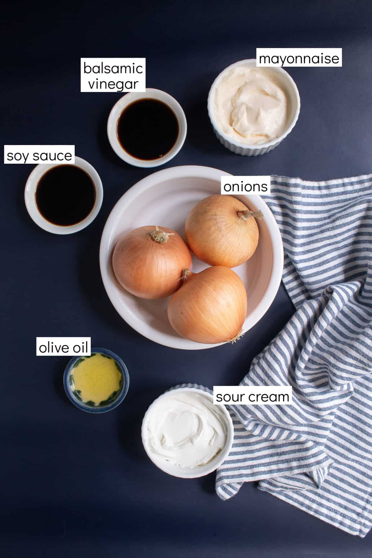 Ingredients for the dip are displayed on a dark blue background and are labeled with white text boxes including soy sauce, balsamic vinegar, mayonnaise, onions, olive oil, and sour cream.