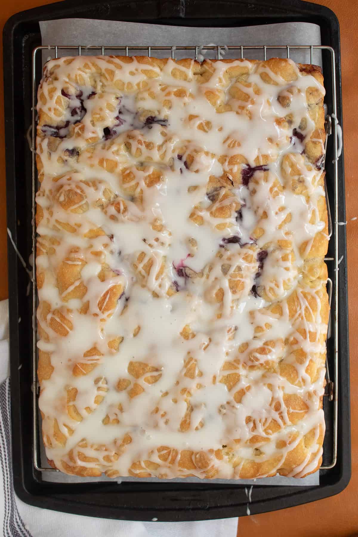 The baked focaccia is generously glazed.