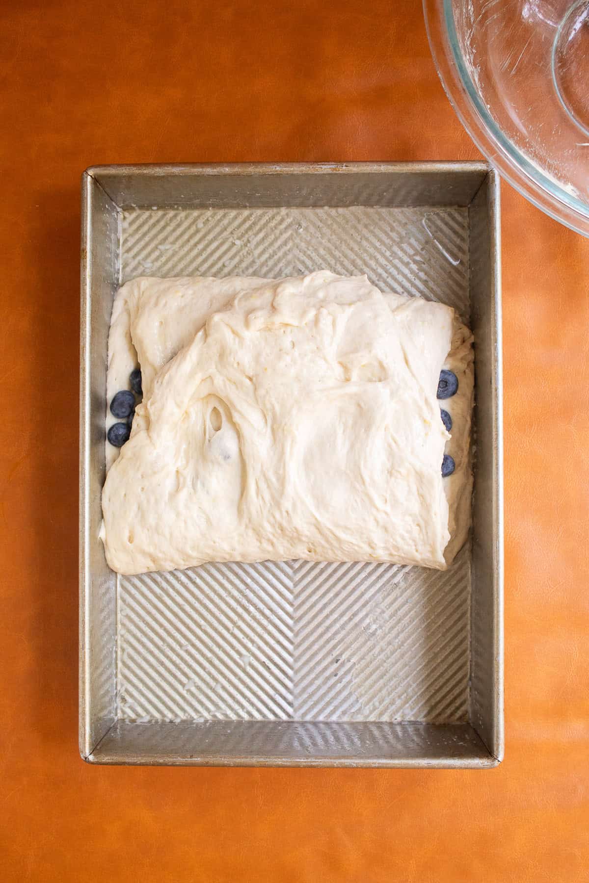 The bottom half of the dough is folder over the top of the berries.