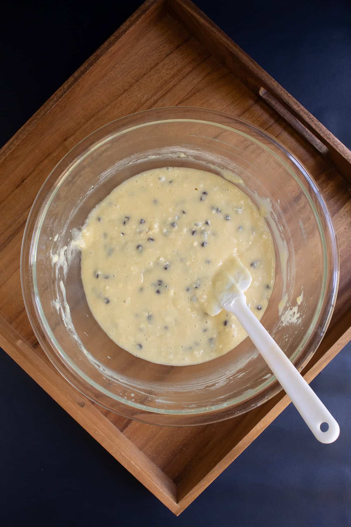 The coffee cake batter is well mixed in the glass bowl.