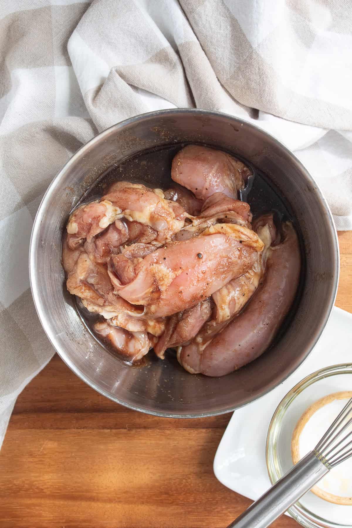 Boneless and skinless chicken thighs are coated in the balsamic marinade.