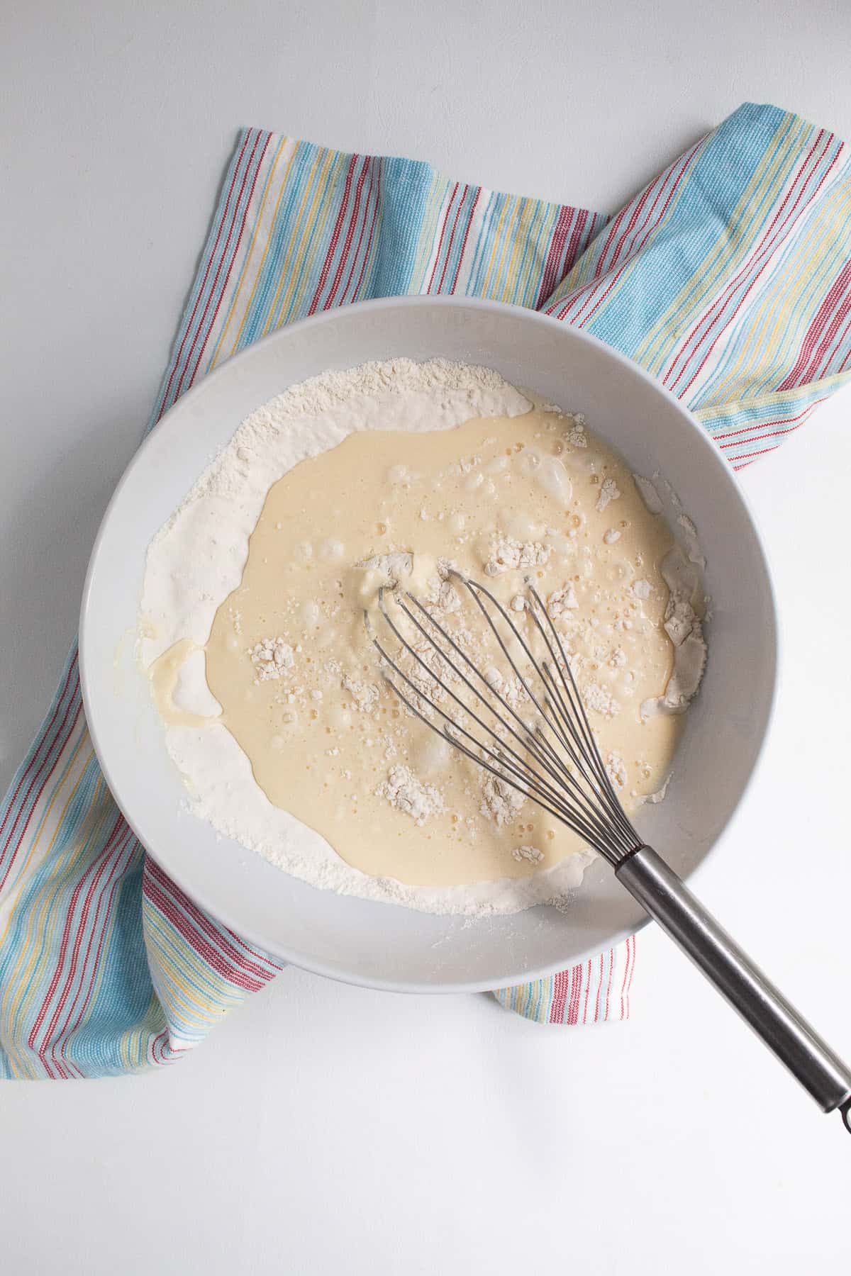 The mixed wet ingredients are added to the dry ingredients.