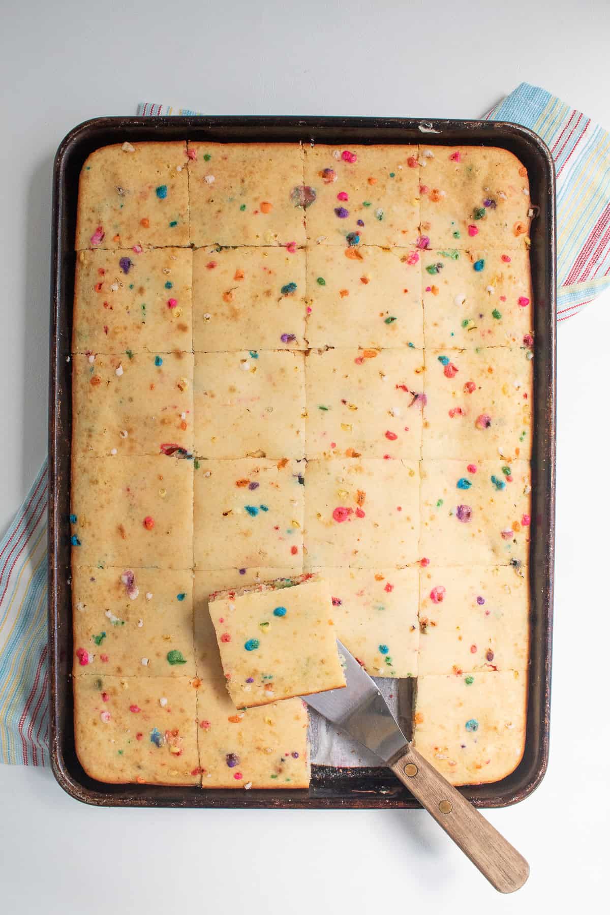 The pancakes are cut into squares and served.