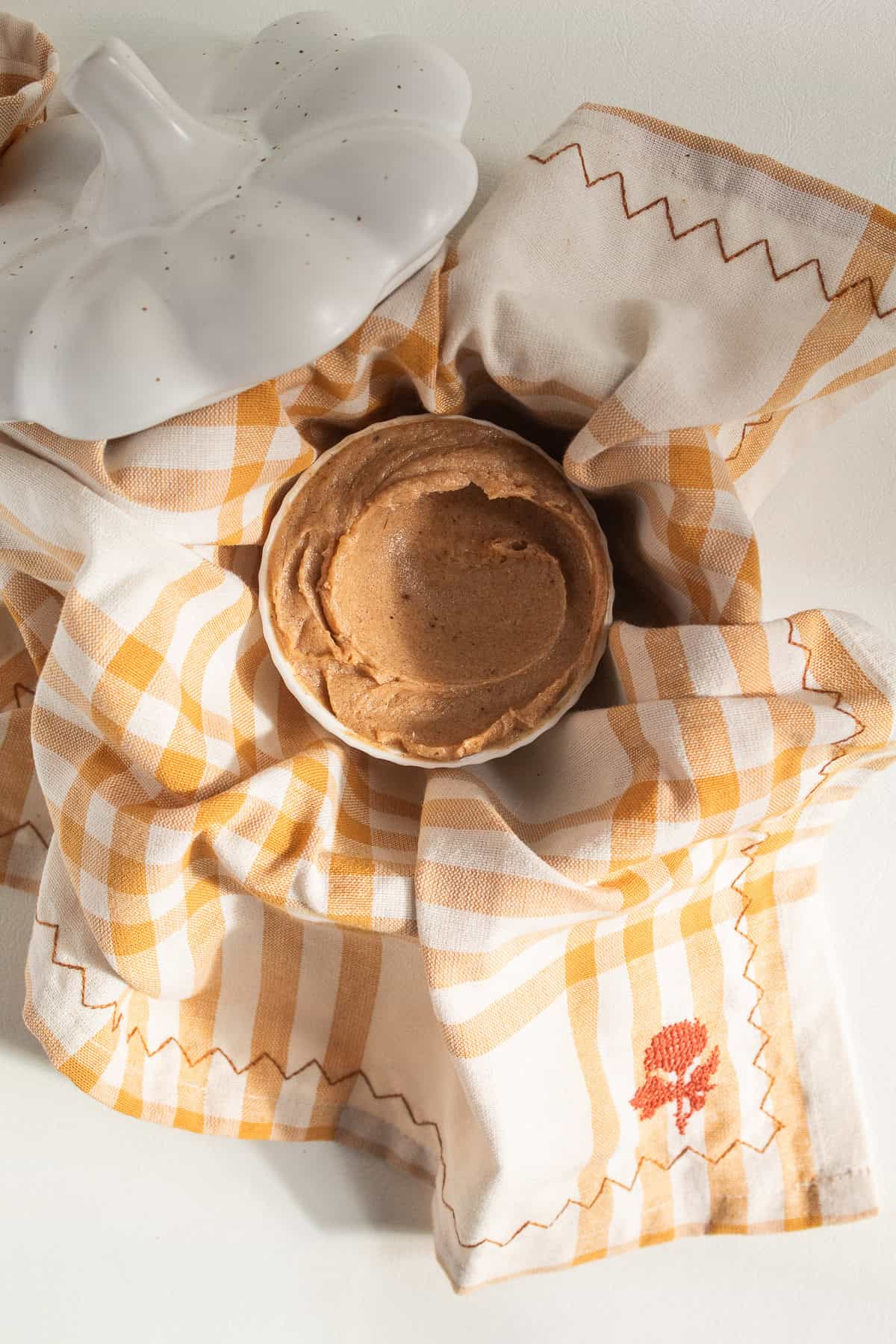 The brown sugar butter is swirled in a small ramekin.