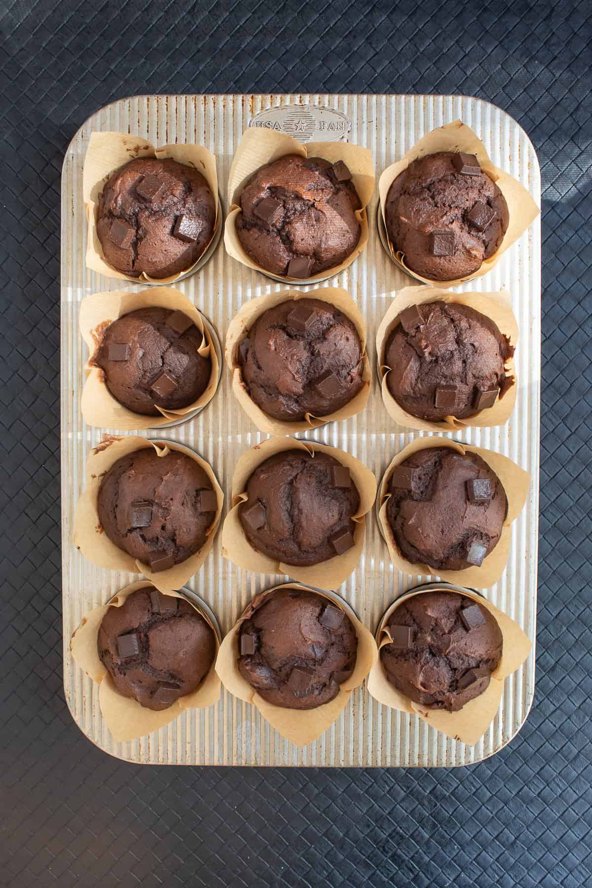 The muffins are puffed and a rich brown color after baking.