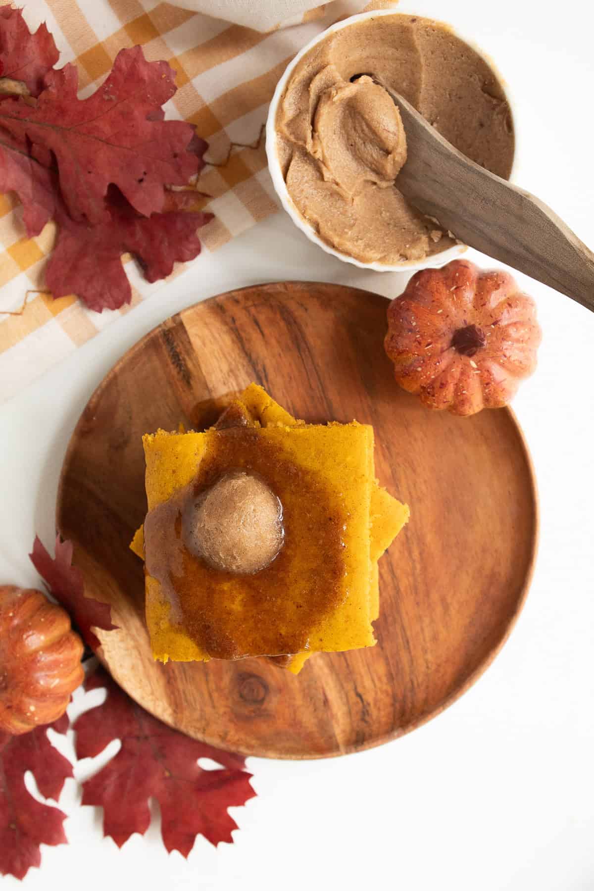 A serving of pancakes is topped with melting butter.