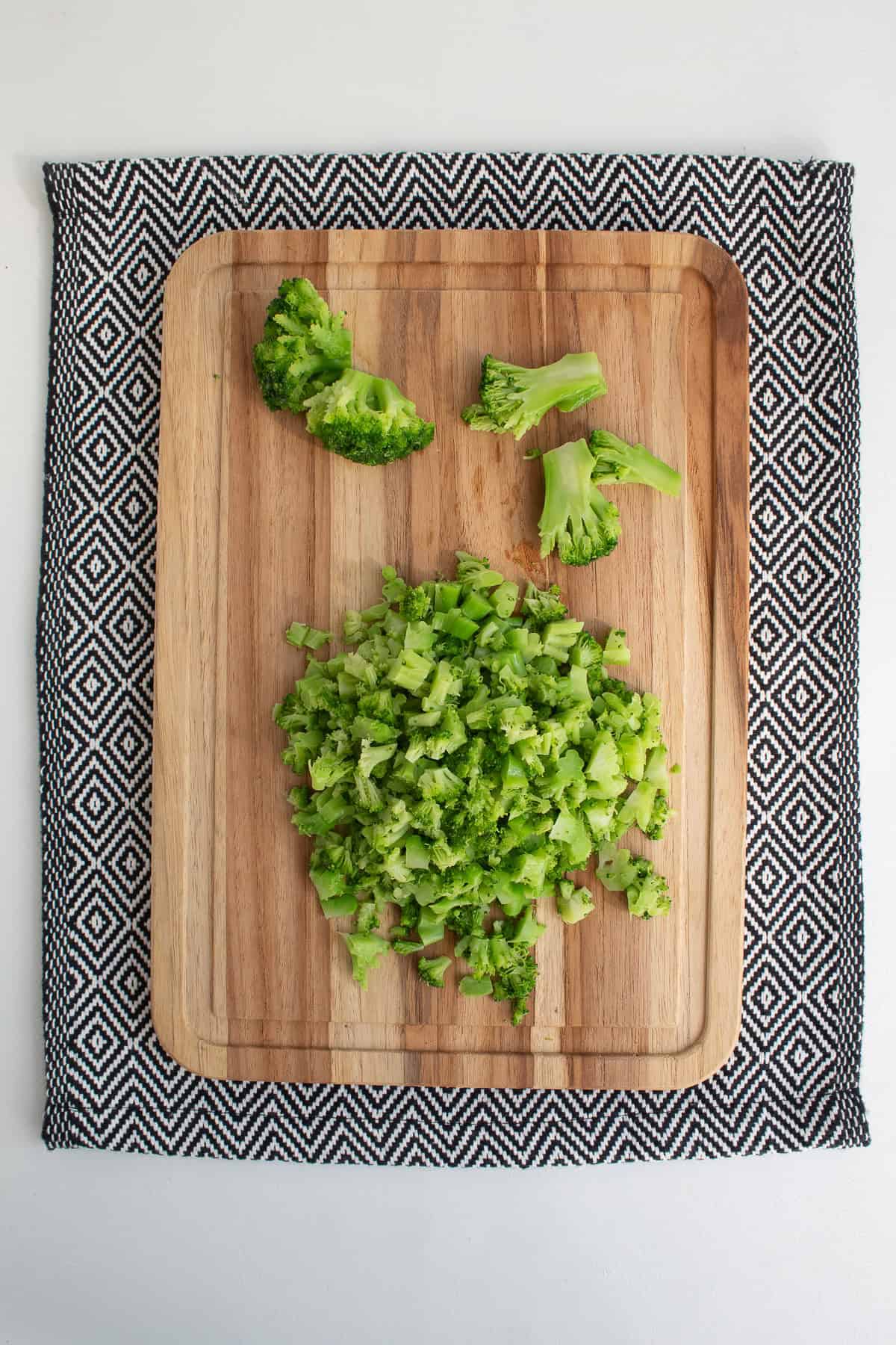 The thawed broccoli is diced into small pieces.