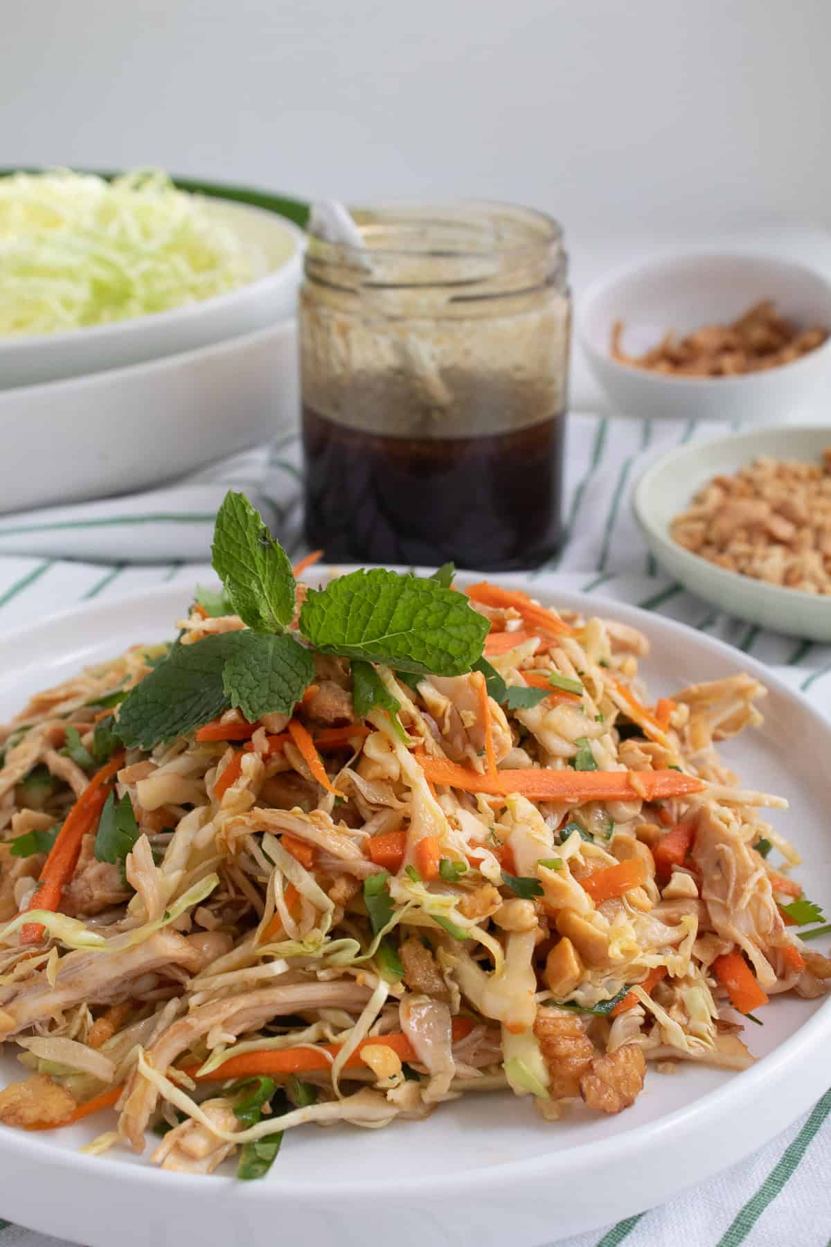 The salad is topped with fresh mint leaves.