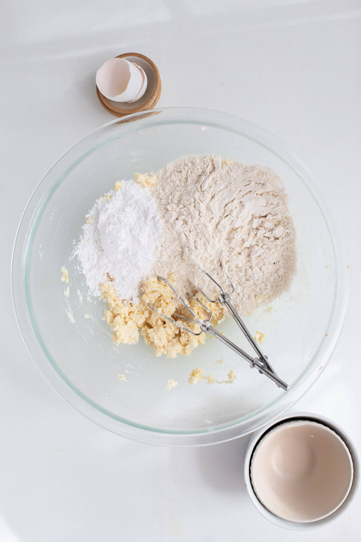 Powdered sugar and flour are added to the butter mixture.