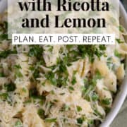 An oval platter is piled with the pasta and garnishes. A white text box at the top of the image contains the words, "one pot pasta with ricotta and lemon" and "plan. eat. post. repeat."