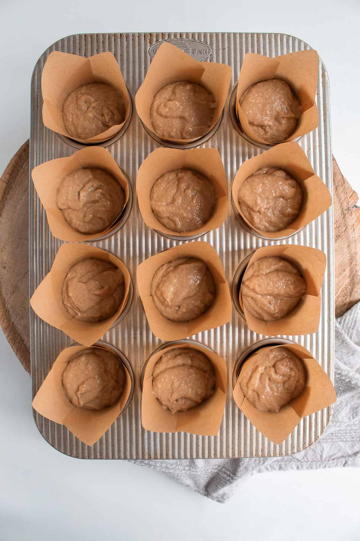 Use a cookie scoop to transfer batter to the muffin liners without spilling.