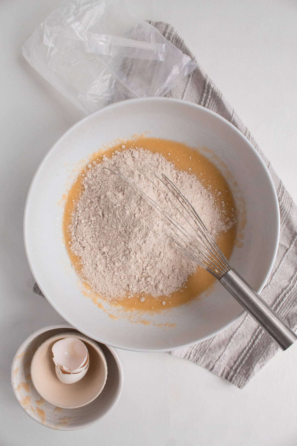 The cake mix is added to the blended wet ingredients.