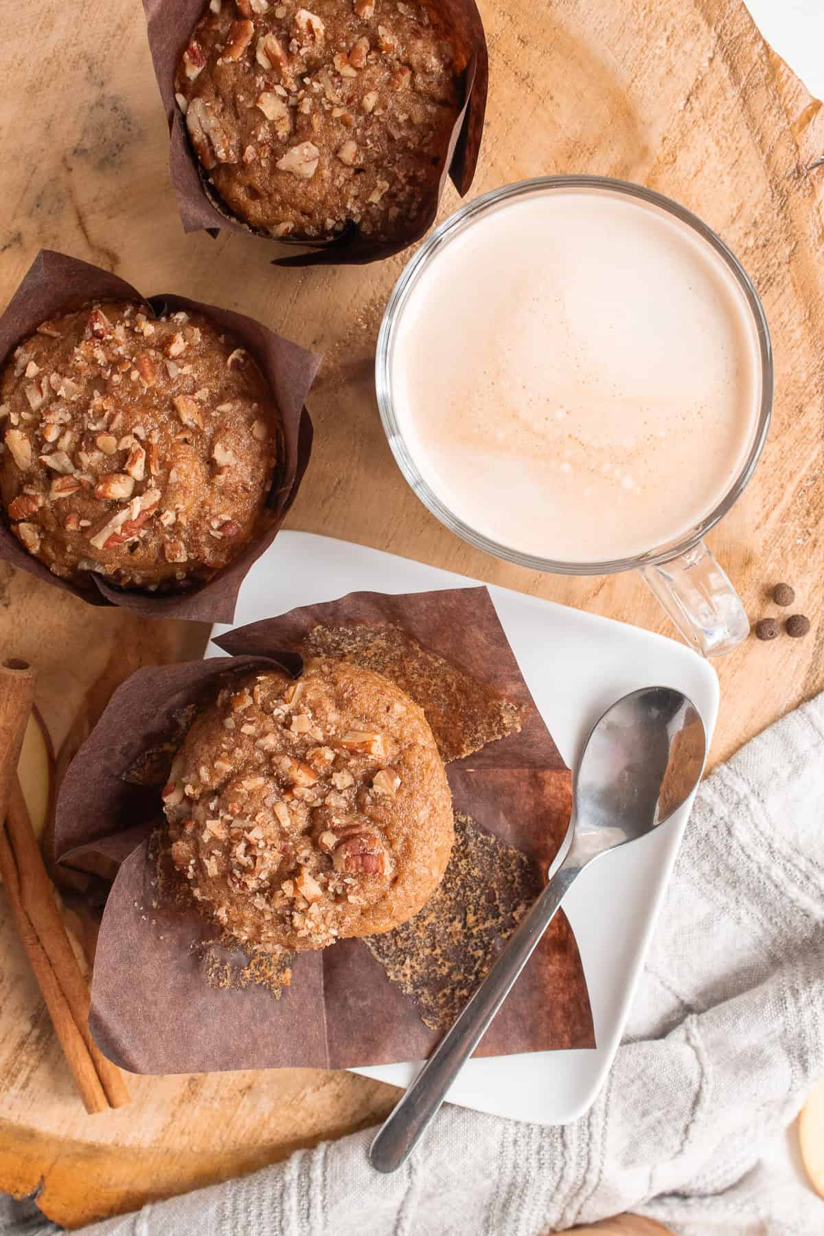 Muffins baked with pecans are served with a latte.