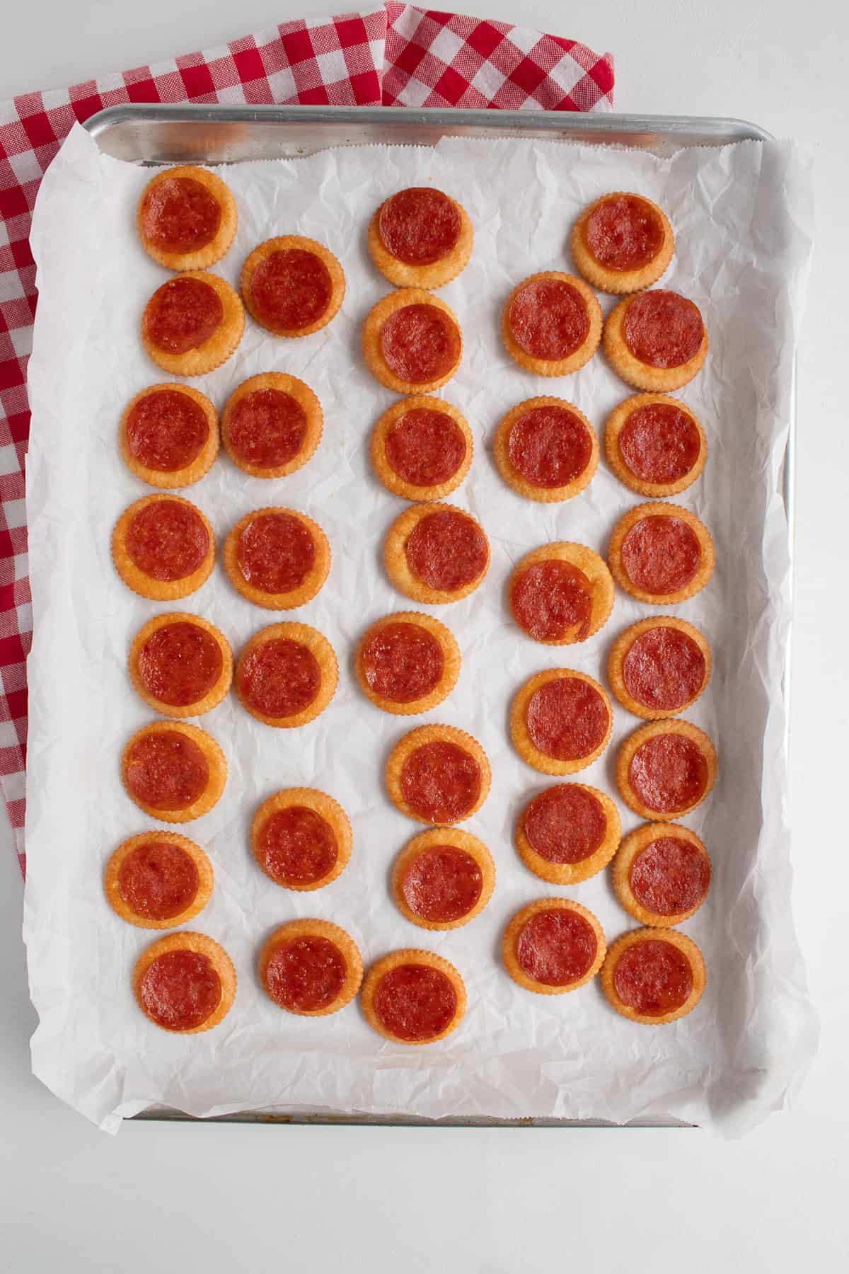 The baked crackers are a golden brown and the pepperoni have crisped up.