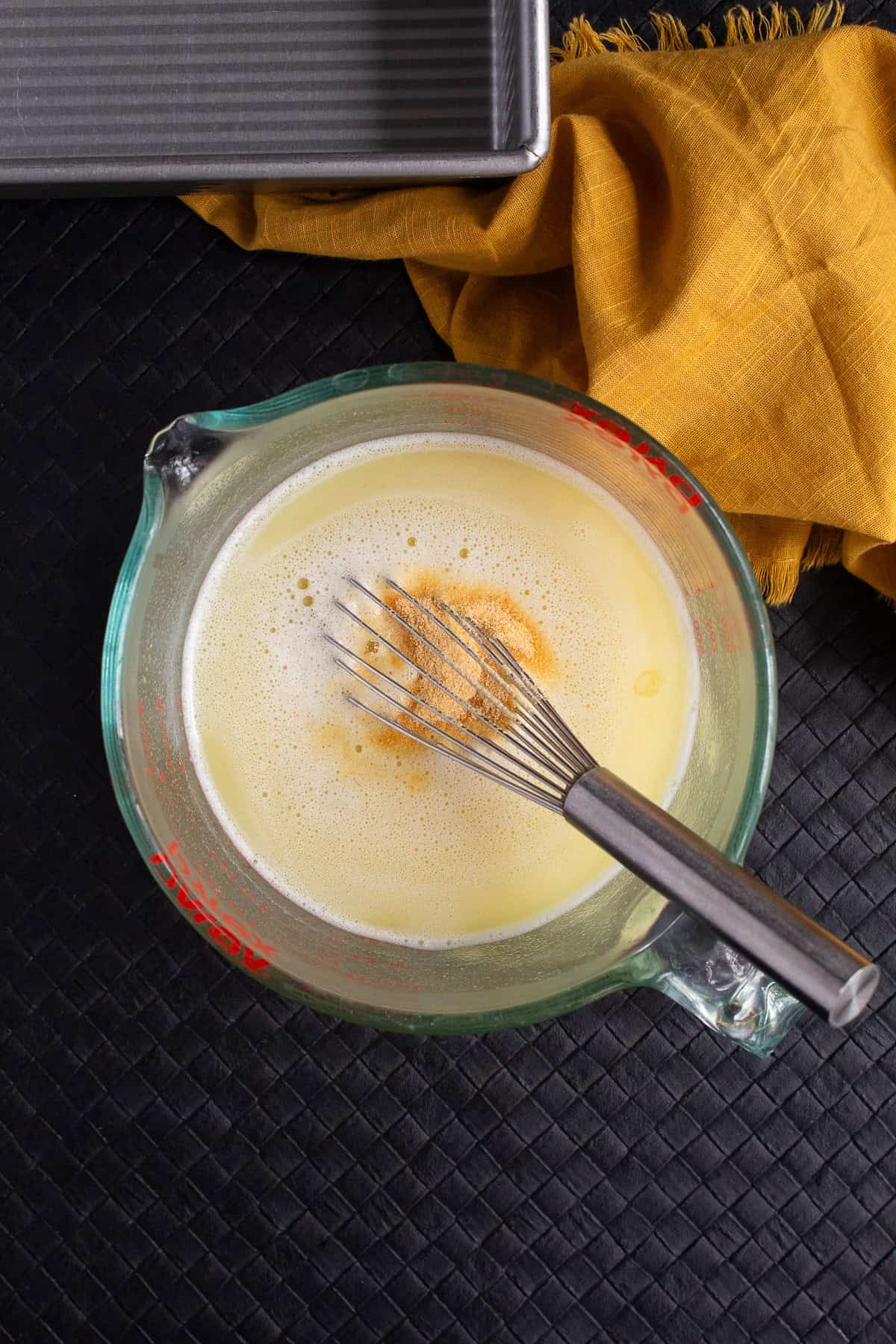 Garlic powder and salt are stirred into the water and butter mixture.