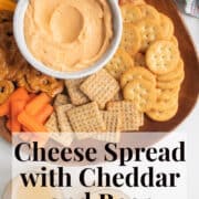 The chilled cheese spread is served with vegetables and crackers on a wood platter. A white text box at the bottom of the image contains the words, "cheese spread with cheddar and beer" and "plan. eat. post. repeat."